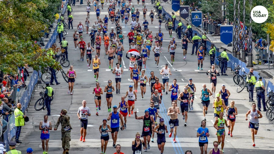 Runners run in the 2021 Boston Marathon.