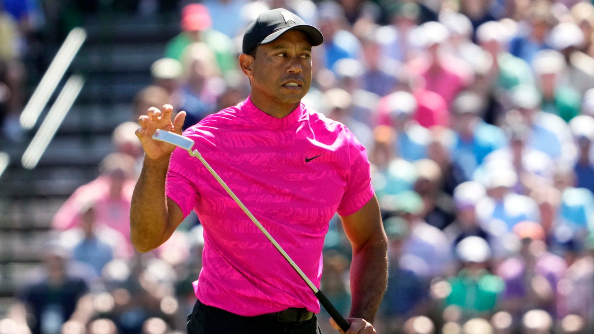 Tiger Woods reacts to his putt on the 15th green during the first round of the Masters.