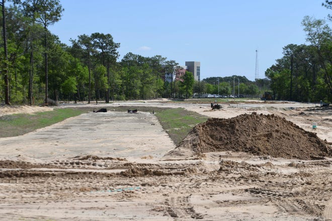 Site work has begun at Freedom Beacon Tech Park off Lewis Turner Boulevard. The 52-acre parcel will house apartments, businesses, a hotel and conference center, and a park when the project is completed.