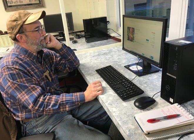 George Catalano checks out online seed catalogs April 7 at the new Cornell Cooperative Extension Madison Ag Business Center in Morrisville.   