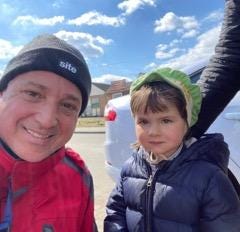 Keith Marion, left, a merchant mariner from Perry Township, recently traveled to Poland on his own to help Ukrainian refugees who fled their homes. Marion plans to return home this week. With him is one of the many children staying in the camp where he is volunteering.