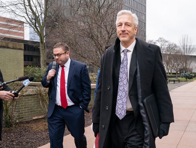 Attorney for Barry Croft, Joshua Blanchard left, leaves the Gerald Ford R. Ford Building and U.S. Courthouse on April 8, 2022, with the attorney for Branden Caserta, Michael Hills , right, just before lunch after jurors in the Governor Whitmer kidnapping case sent U.S. District Judge Robert Jonker a question about being stuck on certain charges.