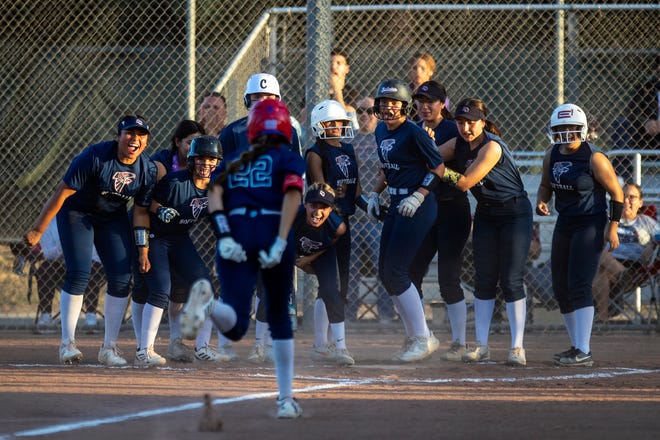 Kassidy Munoz (22) of La Quinta High runs to home plate as teammates cheer after a home run against Shadow Hills in Indio, Calif., on April 7, 2022. La Quinta won 5-4.