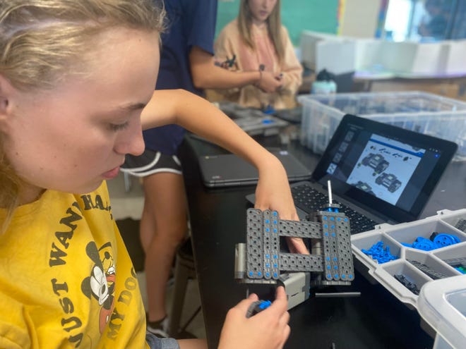 McKinney Pohrman, a 14-year-old eighth grader at Boulder Creek Elementary School, builds a robot at Boulder Creek Elementary STEM and Engineering Club on Wednesday, April 6, 2022.