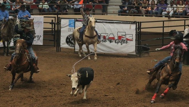 Team ropers compete during the fifth performance of the San Angelo Stock Show & Rodeo at Foster Communications Coliseum on Thursday, April 7, 2022.