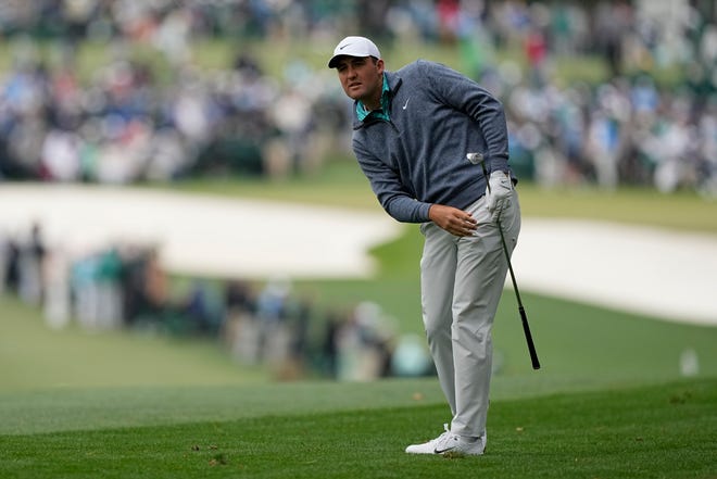 Scottie Scheffler watches from the rough on the first hole during the third round at the Masters golf tournament on Saturday, April 9, 2022, in Augusta, Ga. (AP Photo/David J. Phillip)