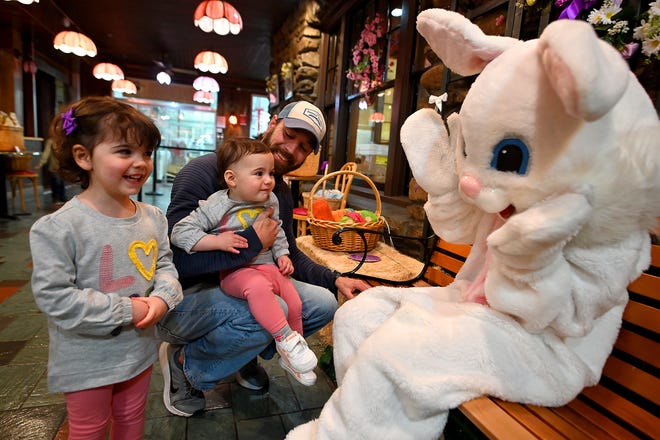 SHREWSBURY - No hard feelings for 17-month-old Natalie O'Coin of Auburn after her tearful visit with the Easter Bunny with dad, Shane, and sister Julia, 2½, at Hebert's Candy Mansion in Shrewsbury on Saturday.