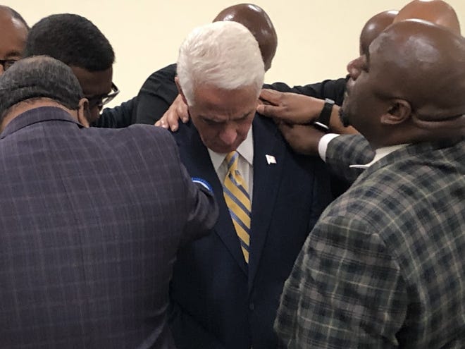Daytona Beach-area pastors lay hands on Charlie Crist, a Democratic candidate for governor, during a visit at Allen Chapel AME Church on Saturday, April 9, 2022. Crist is a former governor who represents the St. Petersburg area in Congress.