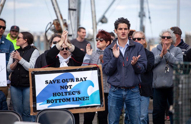 The crowd applauding to the speakers after the speech during the rally against Holtec releasing wastewater from the decommissioned Pilgrim Nuclear Power Station into the Cape Cod Bay in Plymouth on Saturday, April 9, 2022.