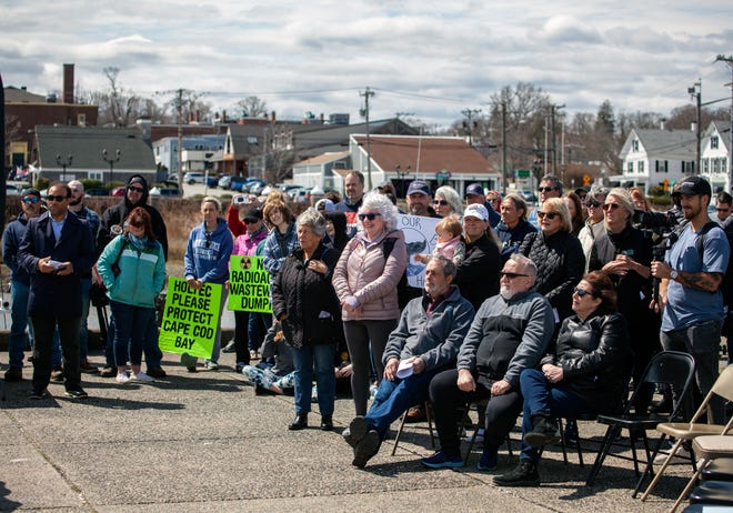 The crowd listens to a speech during the rally against Holtec releasing wastewater from the decommissioned Pilgrim Nuclear Power Station into Cape Cod Bay in Plymouth on Saturday, April 9, 2022.