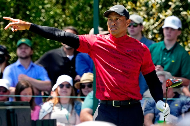 Tiger Woods reacts to his shot on the 14th hole during the final round.