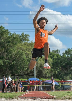 Umatilla’s Kobe Diggs competes in the long jump during Friday's Lake-Sumter Championships at South Sumter High School in Bushnell. Diggs was the overall winner of the event with a jump of 20 feet, 8 inches. [PAUL RYAN / CORRESPONDENT]