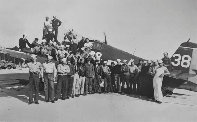 Officers and men assigned to Bunnell Auxiliary Naval Air Station during World War II stand near and on one of their F6F Hellcat fighter airplanes. The station was built during 1943-44 at a cost of approximately $2 million and was located about halfway between Bunnell and Flagler Beach. In 1946 the field was turned over free of charge to Flagler County and now serves as the Flagler County Executive Airport.
