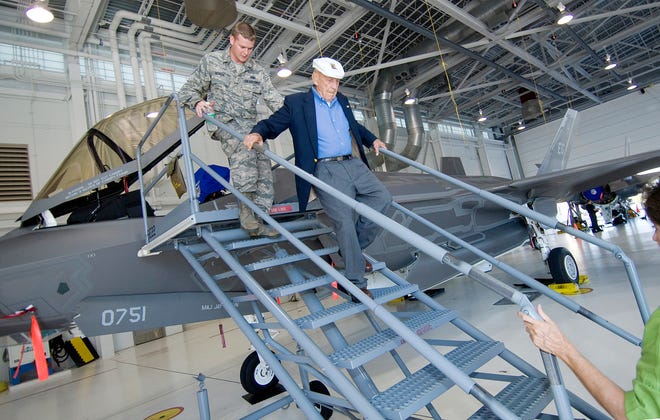 F-35 Crew Chief Staff Sgt. Skyler DeBoer helps Richard Cole down a set of stairs while giving the Doolittle Raider a tour of the Air Force's newest fighter, the F-35, at Eglin Air Force Base in this Daily News photo from October 2012.