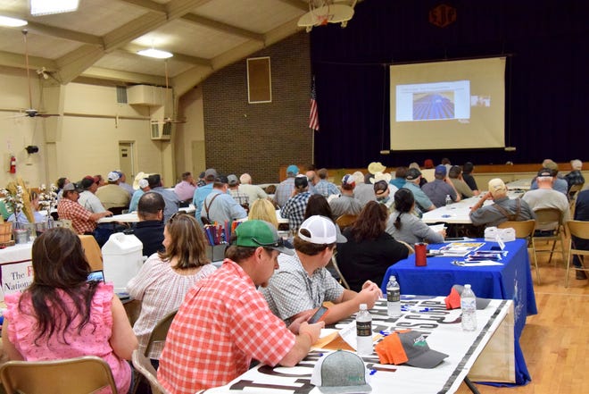 Local farmers watch a presentation by Texas A&M Agrilife at Ag Day on Tuesday, April 5, 2022.