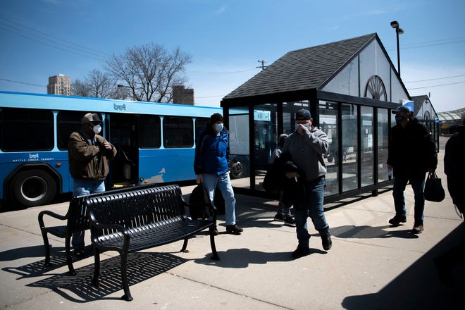 Passengers arrive at the Battle Creek Transit transportation center on Tuesday, April 5, 2022.