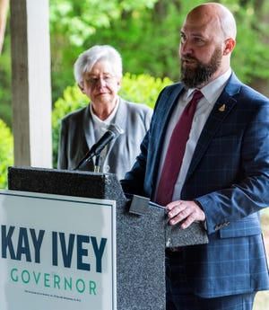 Alabama Governor Kay Ivey looks on as Art Thomm, with the NRA,  as he announces the NRA’s endorsement of Ivey in her run for re-election during a press conference at the Lower Wetumpka Road Shotgun Sports Club in Montgomery, Ala., on Monday April 11, 2022. 