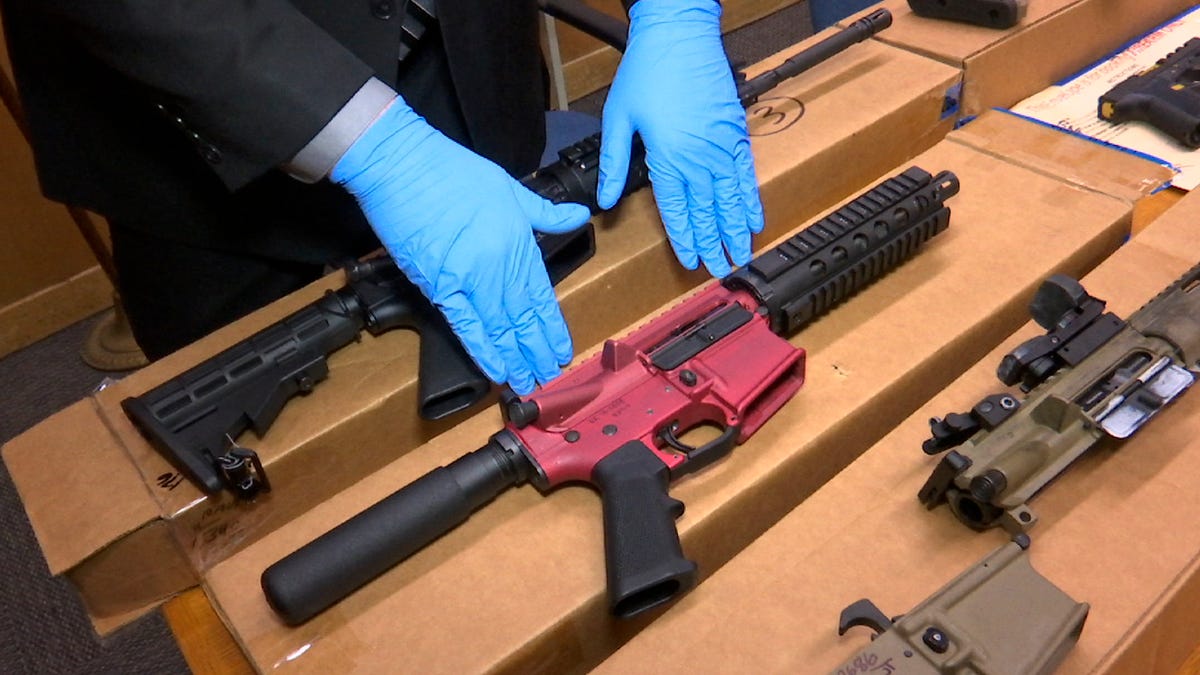 Sgt. Matthew Elseth displays "ghost guns" at the headquarters of the San Francisco Police Department on Nov. 27, 2019.