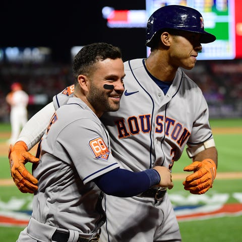 Astros shortstop Jeremy Pena is greeted by second 