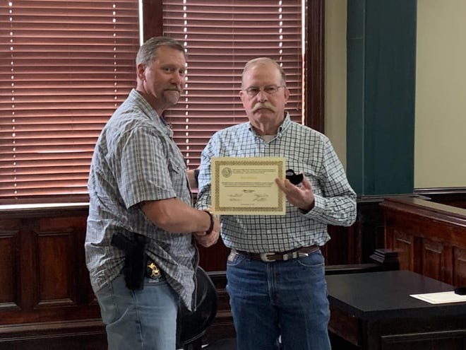 Capt. Ben Moore with the Erath County Sheriff's Office was recently presented a certificate and pin for his five years of service to the citizens of Erath County by the Commissioners Court.