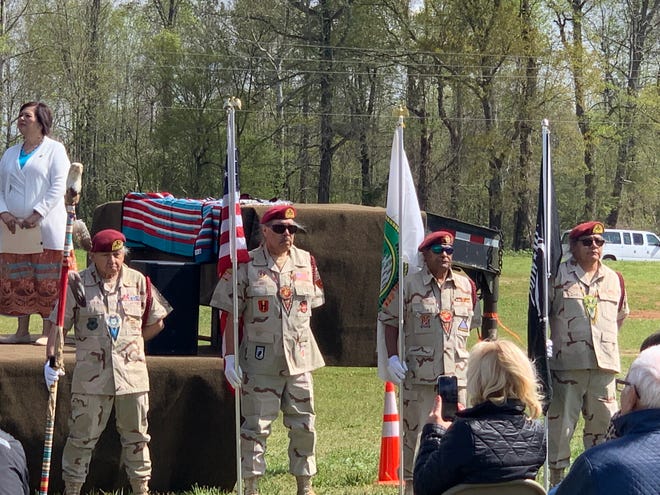 Members of the MCN Honor Guard hold the Muscogee Creek Nation flag alongside the U.S. flag during a presentation of colors April 8, 2022, in Oxford.