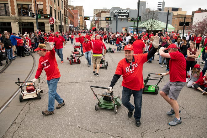Wapakoneta's Optimist Precision Lawn Mower Drill Team performs in the 103rd Findlay Market Opening Day Parade in downtown Cincinnati on Tuesday, April 12, 2022.