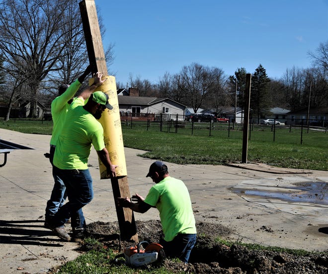 Village of Baltimore employees install a post for a new shade pavilion at the Baltimore swimming pool Tuesday, April 12. The project is set to be finished before the pool opens for the summer.