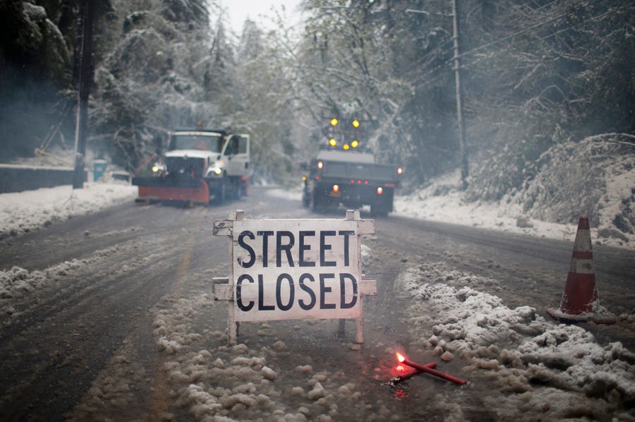 Crews closed roads as several inches of snow fell in the Portland area on, Monday, April 11, 2022. Portland received the first measurable snowfall in April in recorded history on Monday.