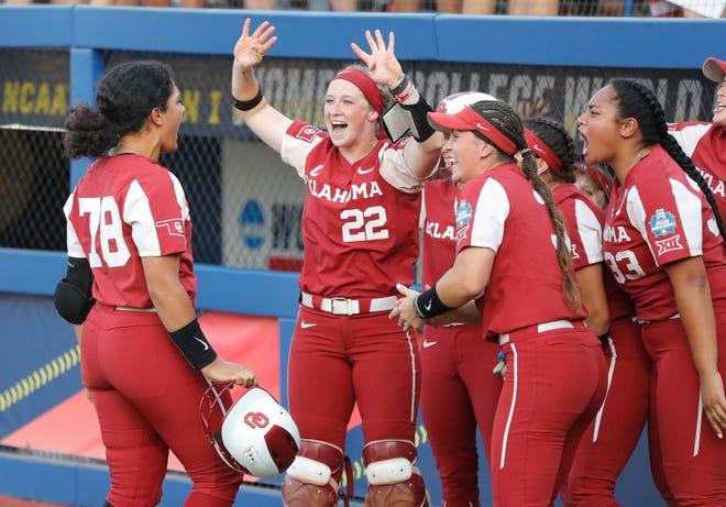 Oklahoma's Jocelyn Alo, left, is met by teammates after she hit a home run against Florida State in last year's championship series of the Women's College World Series. OU, the defending national champions, are 36-0 and led this season by Alo, the nation's top hitter.
