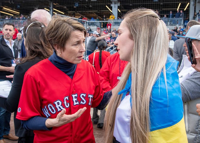 Attorney General Maura Healey speaks with student and Ukrainian native Iryna Nos before the Worcester Red Sox home opener at Polar Park Tuesday. Both participated in the opening ceremony.