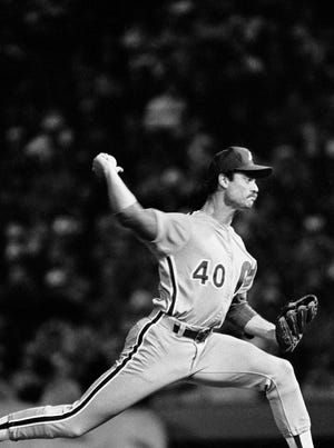 Philadelphia Phillies pitcher John Denny delivers a pitch in the early innings of the first game of the World Series, Tuesday, Oct. 11, 1983, Baltimore, Md. (AP Photo)