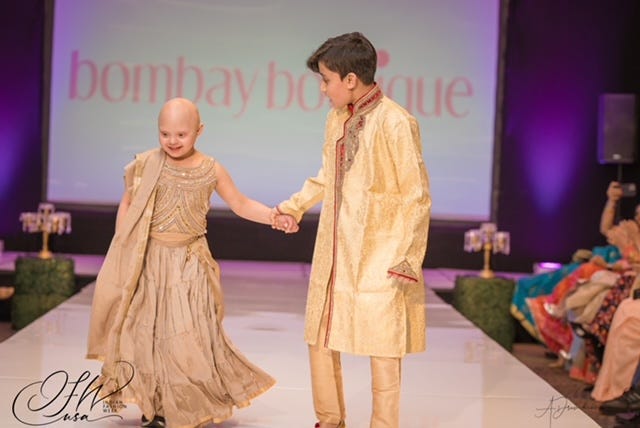Brother and sister Aditya and Aarohi Patton model clothes for Bombay Boutique.