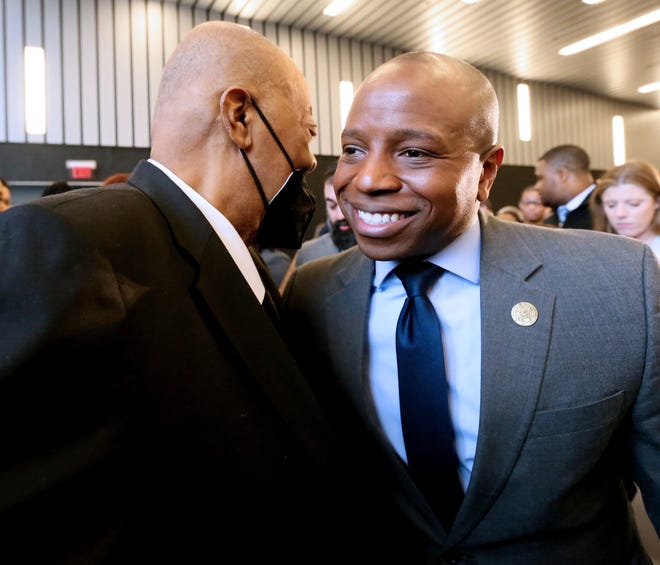 Milwaukee Mayor Cavalier Johnson, right, is greeted by Bishop Sedgwick Daniels, who gave the invocation on Wednesday at the Harley-Davidson Museum.