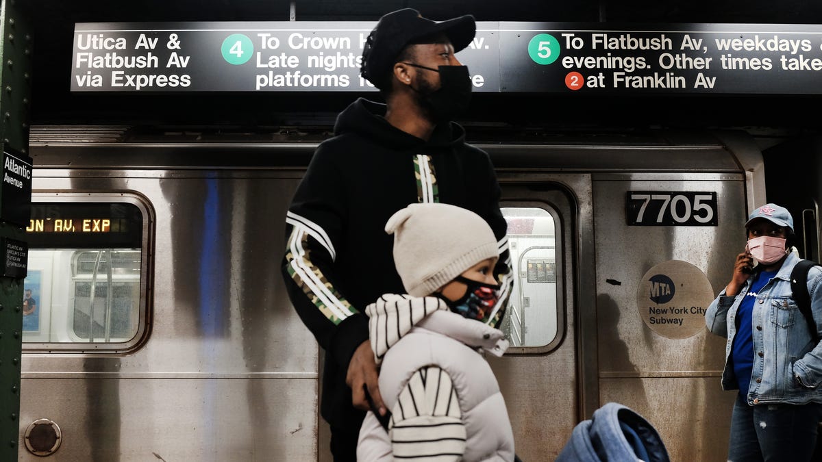 People return to the Brooklyn subway April 13, a day after a man shot several people on a Manhattan-bound train in the Sunset Park neighborhood of New York City.
