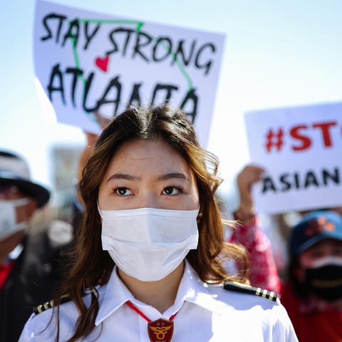 People demonstrate at the 'Stop Asian Hate March a