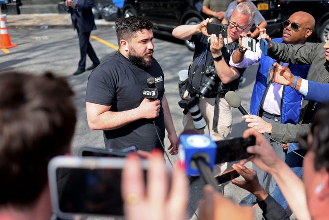 Zack Tahhan, a witness who reportedly notified police of Frank James' whereabouts, gives an interview after leaving the 9th Precinct where James is currently being held in police custody for his connection to yesterday's shooting at the 36th St subway station on April 13, 2022 in New York City.