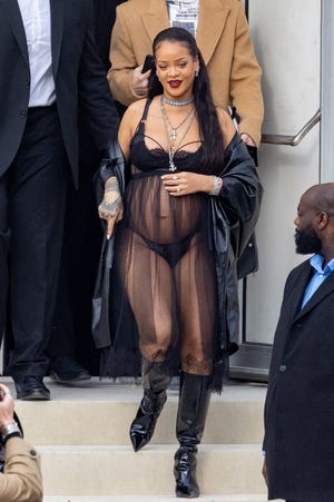 Rihanna turned heads as she attended the Dior fashion show during Paris Fashion Week wearing see-through tulle and Savage X Fenty lingerie.
