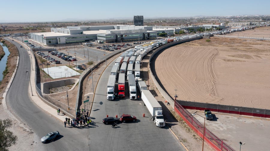 A long line of trucks is seen stalled at the Zaragoza International Bridge, one of two ports of entry in Ciudad Juarez going into the U.S. on April 12, 2022. The truckers blocked both north and southbound commercial lanes in protest after prolonged processing times implemented by Gov. Abbott which they say have increased from 2-3 hours up to 14 hours in the last few days.