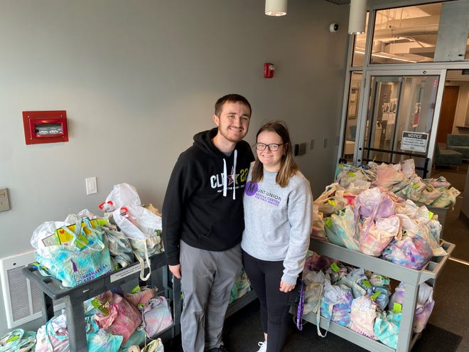 Jacob Buttar, left, and Kaylee Adkins, student assistants with the Regula Center at University of Mount Union, recently delivered gifts for children in Project KARE.