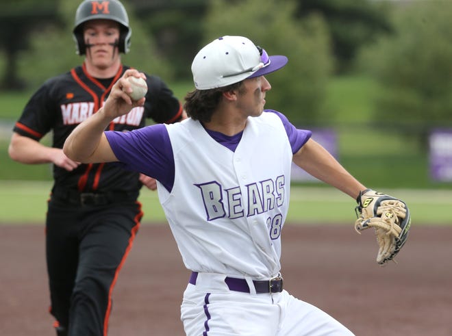 Shea White, right, of Jackson gets Garret Odey, left, out at third base before throwing to first during their game at 