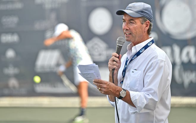 Always ready to entertain and inform, Ray Collins (master of ceremonies) introduces the next tennis match during the Elizabeth Moore Sarasota Open, being played for the first time at the City of Sarasota's recently renovated Payne Park Tennis Center. Men's single and double matches continue through Easter Sunday.