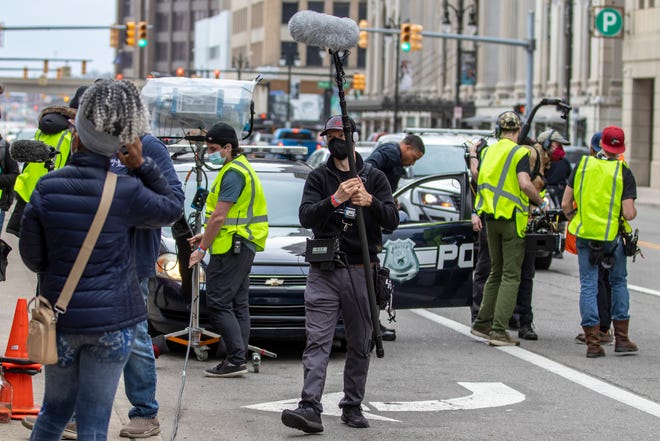 A movie crew films scenes for upcoming film Stealing Jokes by Mike Young and produced by Woodward Original outside of American Coney Island in Detroit on Wednesday, April 13, 2022.