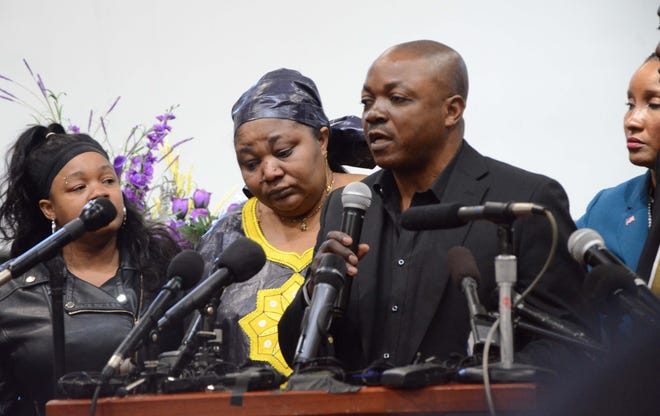 Patrick Lyoya's parents, Dorca, center, and Peter Lyoya speak to the media Thursday during a press conference at a Grand Rapids church.