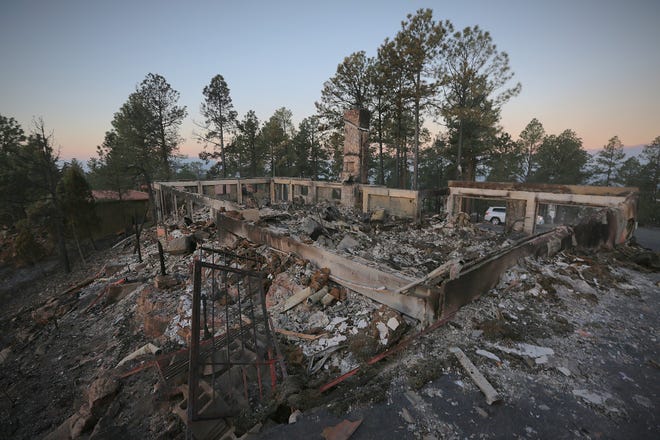 The McBride Fire that ripped through Ruidoso left this home on McBride Drive in ruins on April 14, 2022, All that was left of the two-story house are smoldering remains.