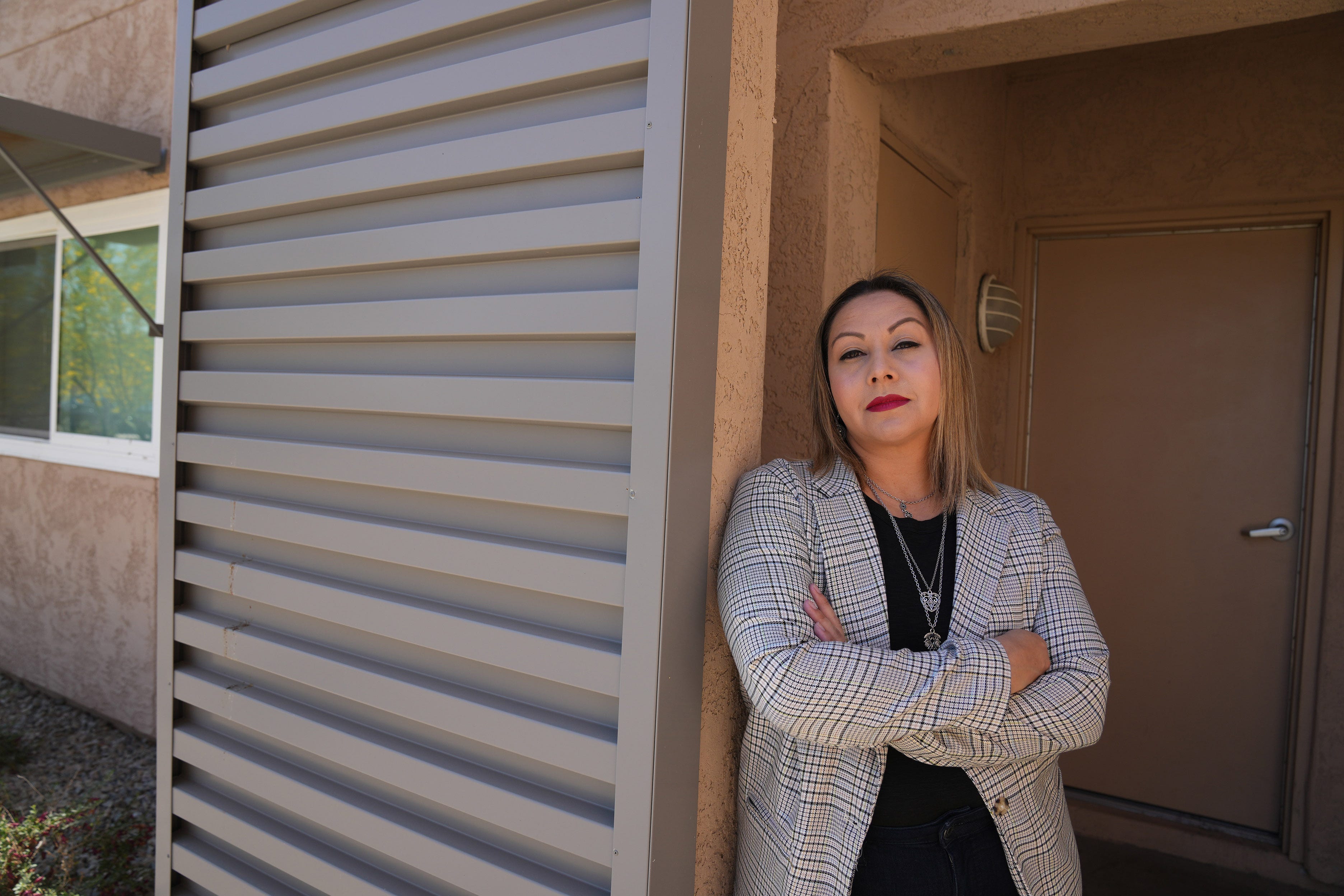Star Reyes, client services manager for Raza Development Fund, stands outside of Roeser Village: FSL, a much-needed affordable housing project in south Phoenix. Raza was a lender for the housing project.