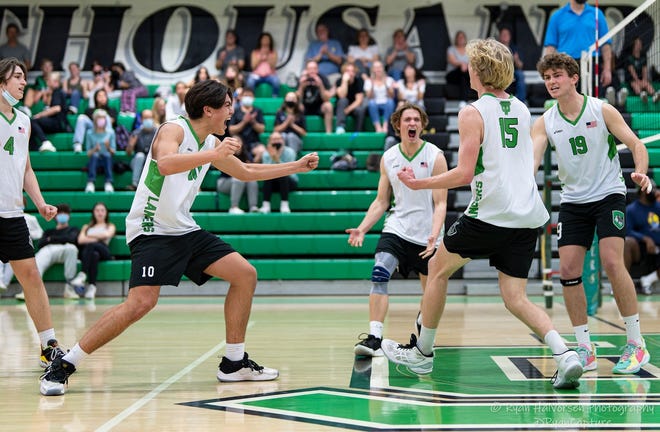 The Thousand Oaks High boys volleyball team celebrates during its sweep of Newbury Park on Wednesday night that clinched the outright Marmonte League title.