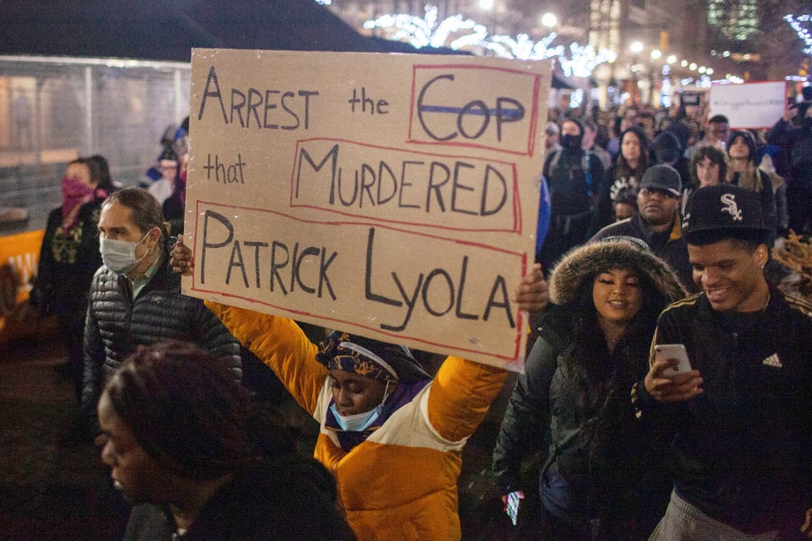 Protesters march through downtown Grand Rapids, Mich., near the police department during a demonstration held after videos of the shooting of Patrick Lyoya, by a Grand Rapids police officer from April 4, were released to the public on Wednesday, April 13, 2020.