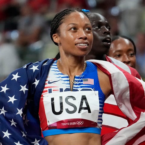 Allyson Felix celebrates after Team USA won the 4x