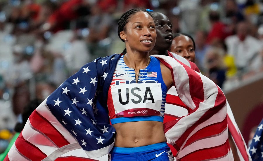 Allyson Felix celebrates after Team USA won the 4x400-meter women's relay at the Tokyo 2020 Summer Olympic Games.
