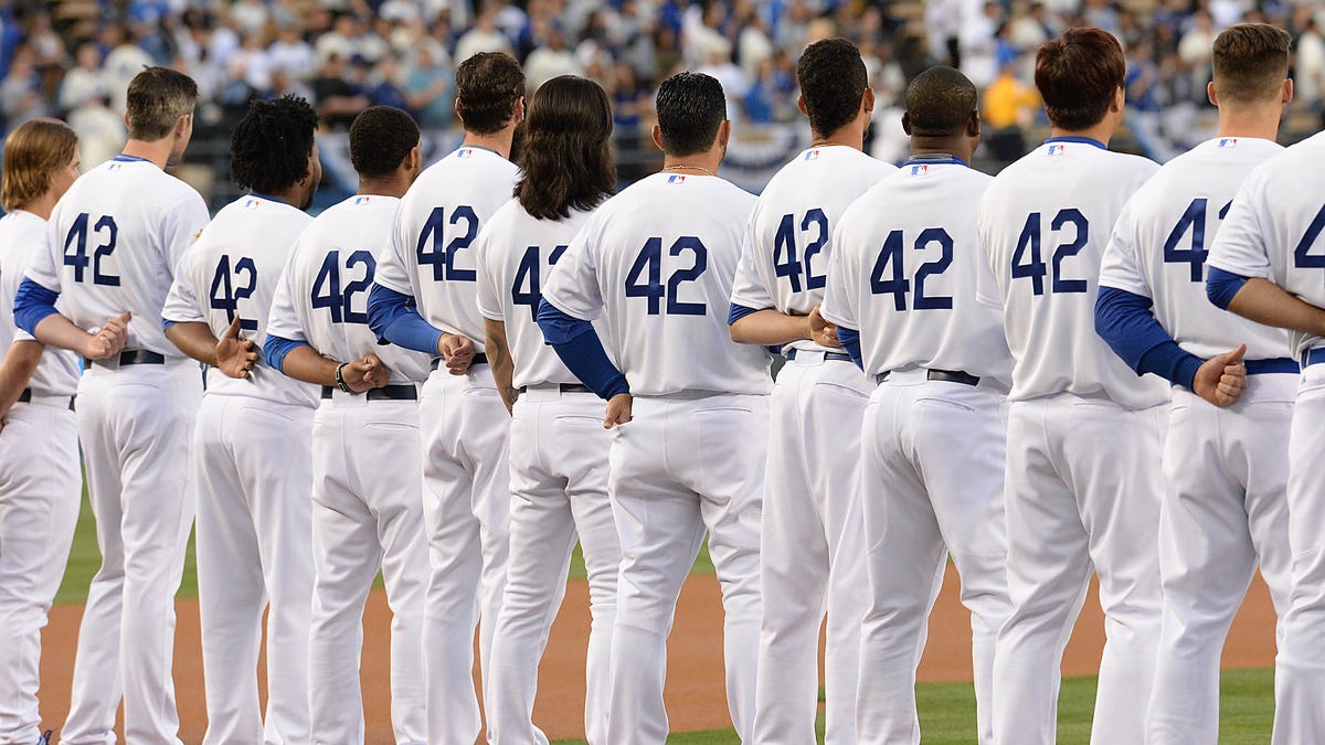 Players on the Dodgers line up for the National Anthem to commemorate Jackie Robinson Day in 2021.